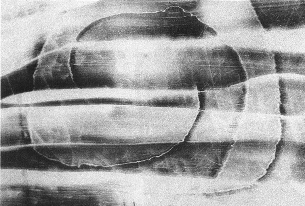 Layered monochrome print of rounded horizontal forms